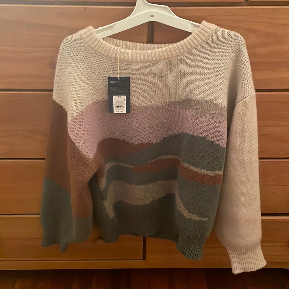 Brand new universal thread sweater. Size small